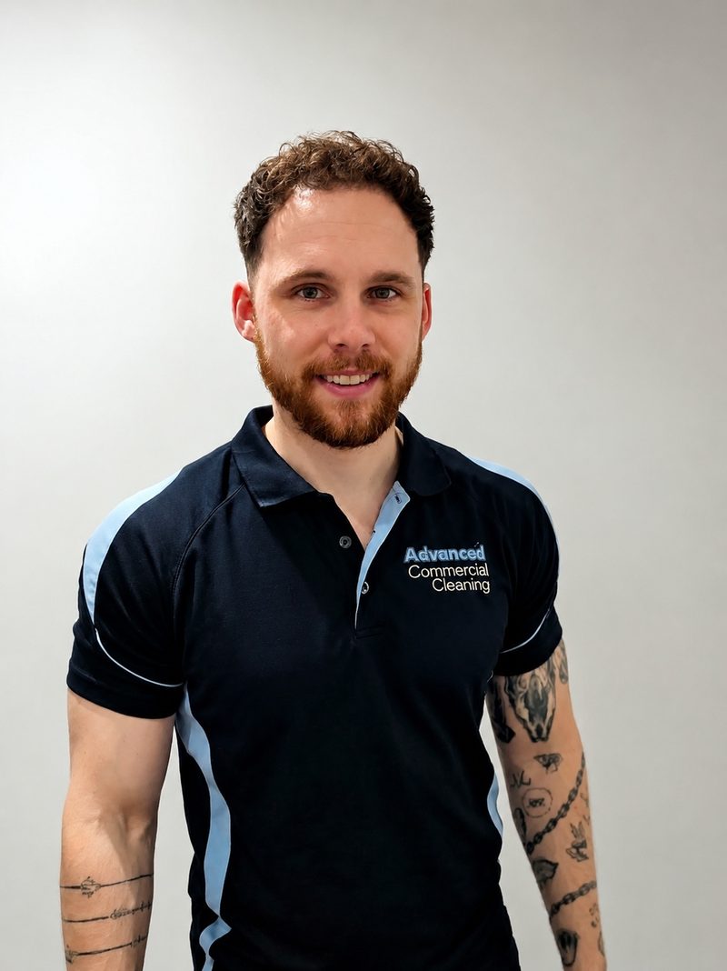 Ash, owner of Advanced Commercial Cleaning, in navy ACC polo shirt
